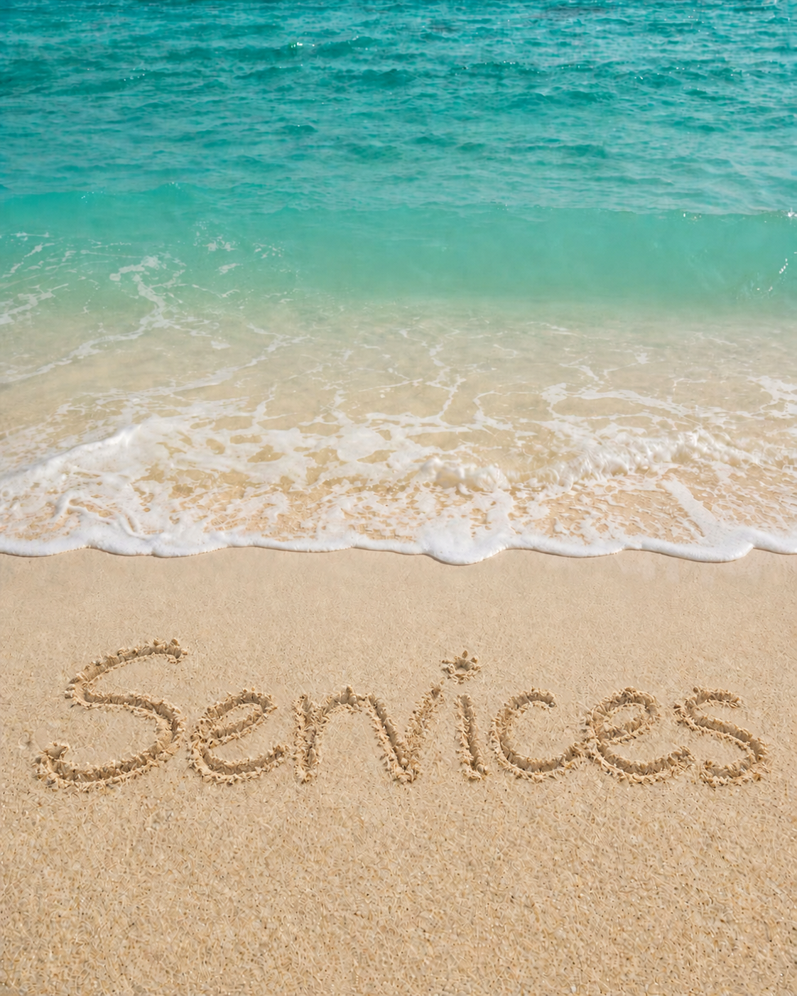 The word Services written in sand beside turquoise sea